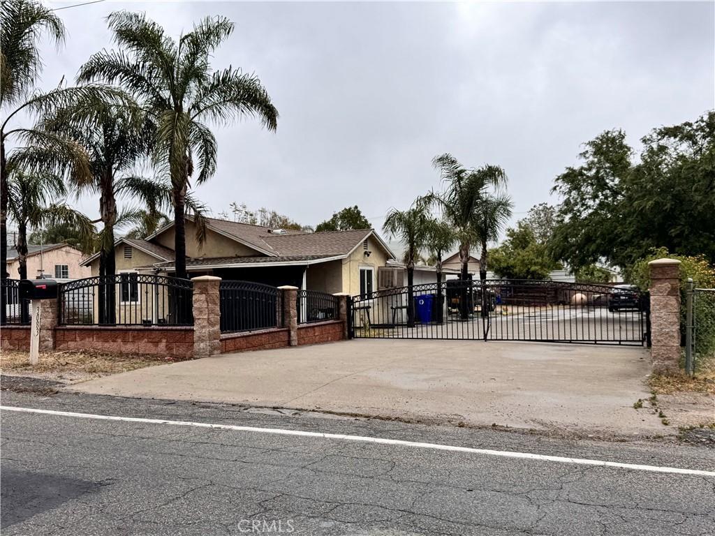 3083 N Macy St, San Bernardino, CA 92407 - view of gate featuring a fenced front yard
