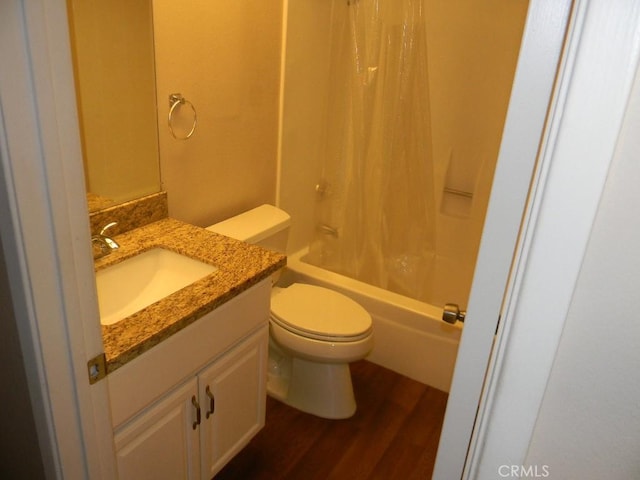 6045 Promontory Ln, Riverside, CA 92506 - bathroom with vanity, wood finished floors, toilet, and shower / bath combo with shower curtain