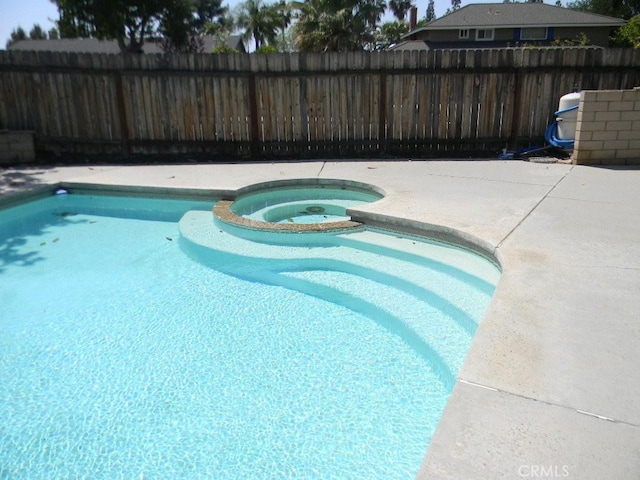 6045 Promontory Ln, Riverside, CA 92506 - view of pool featuring fence, a pool with connected hot tub, and a patio area