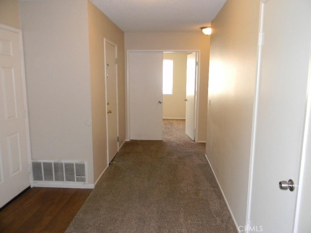 6045 Promontory Ln, Riverside, CA 92506 - corridor featuring visible vents and baseboards