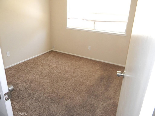 6045 Promontory Ln, Riverside, CA 92506 - empty room featuring baseboards and carpet