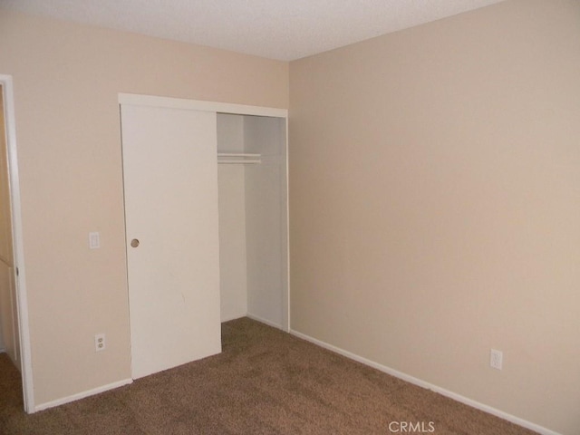 6045 Promontory Ln, Riverside, CA 92506 - unfurnished bedroom featuring carpet and a closet