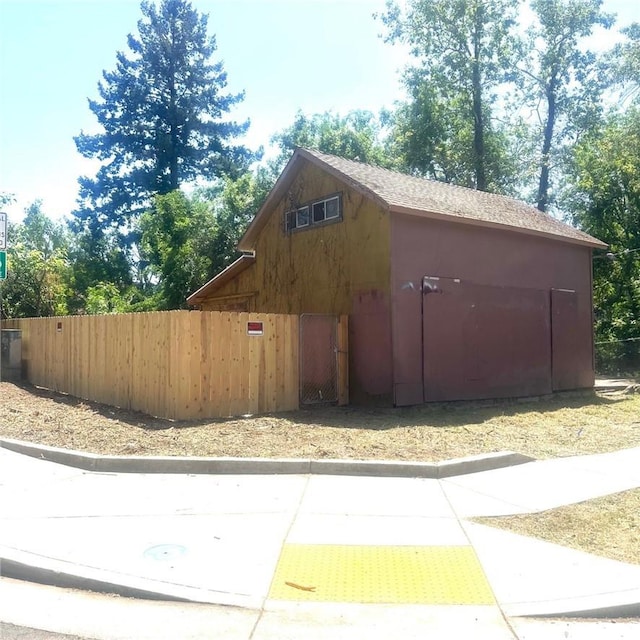 view of property exterior with fence