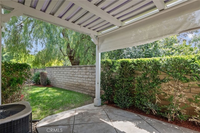 view of patio with a fenced backyard and cooling unit