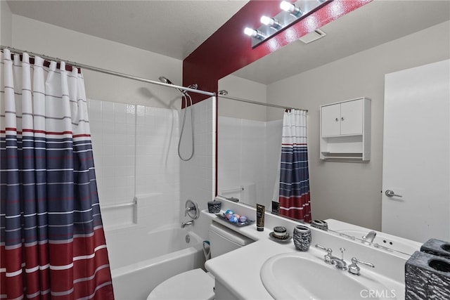 full bathroom featuring toilet, shower / bathtub combination with curtain, and vanity