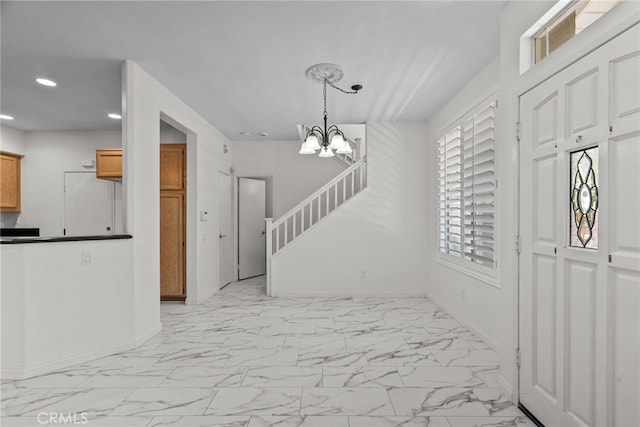 27017 Big Rpds Unit 37, Valencia, CA 91354 - entrance foyer featuring light marble finish flooring, recessed lighting, a chandelier, and stairs