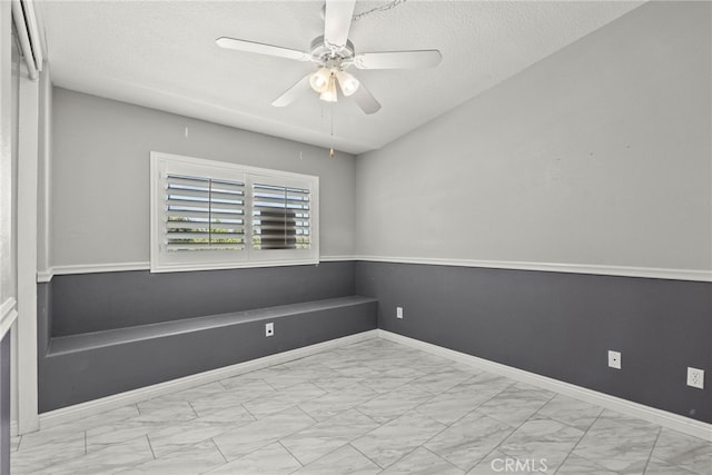 27017 Big Rpds Unit 37, Valencia, CA 91354 - empty room featuring marble look tile flooring, ceiling fan, and a textured ceiling