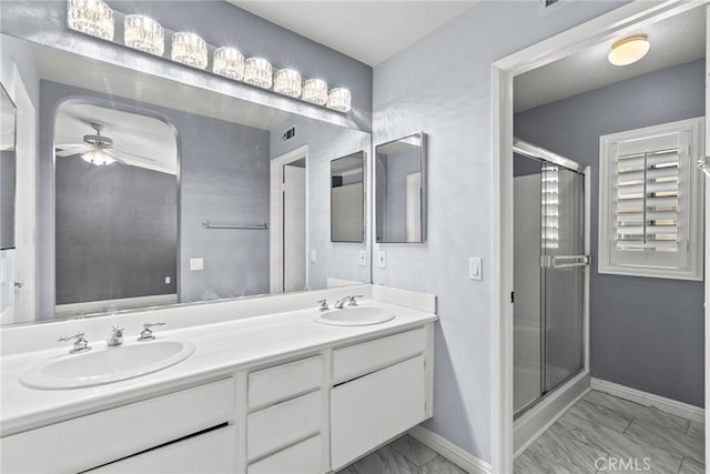 27017 Big Rpds Unit 37, Valencia, CA 91354 - full bathroom with marble finish floors, double vanity, a shower stall, and a ceiling fan