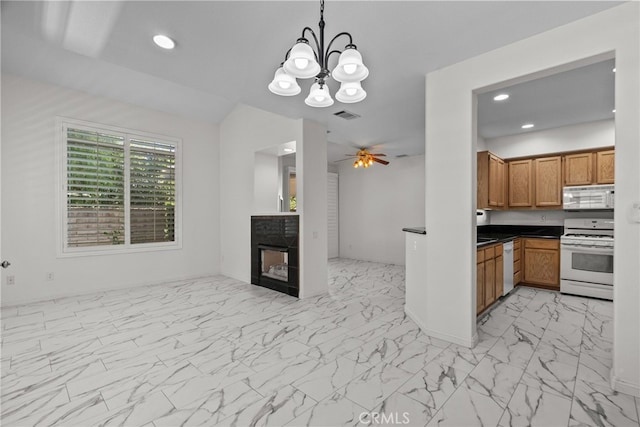27017 Big Rpds Unit 37, Valencia, CA 91354 - kitchen featuring white appliances, light marble finish flooring, open floor plan, brown cabinetry, and recessed lighting