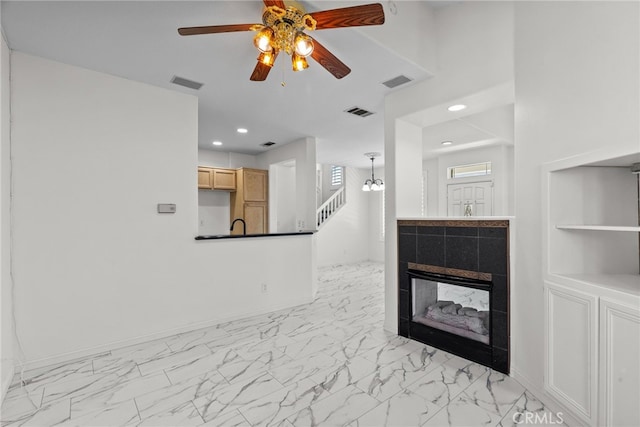 27017 Big Rpds Unit 37, Valencia, CA 91354 - unfurnished living room featuring light marble finish floors, ceiling fan, stairway, recessed lighting, and a fireplace