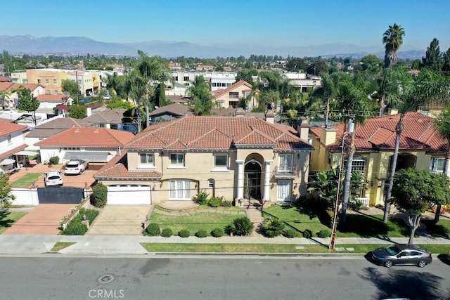 drone / aerial view with a residential view and a mountain view