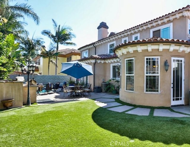 8531 10th St, Downey, CA 90241 - rear view of house with a patio, stucco siding, and a chimney