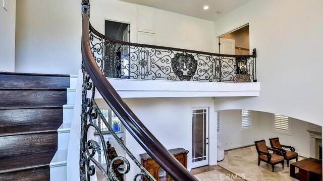 8531 10th St, Downey, CA 90241 - stairway featuring recessed lighting, healthy amount of natural light, arched walkways, and a high ceiling
