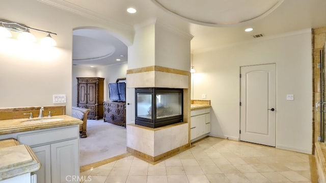 full bathroom featuring visible vents, ornamental molding, vanity, tile patterned floors, and a shower stall