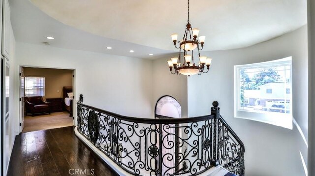 8531 10th St, Downey, CA 90241 - hall with an upstairs landing, recessed lighting, a chandelier, and dark wood-style flooring