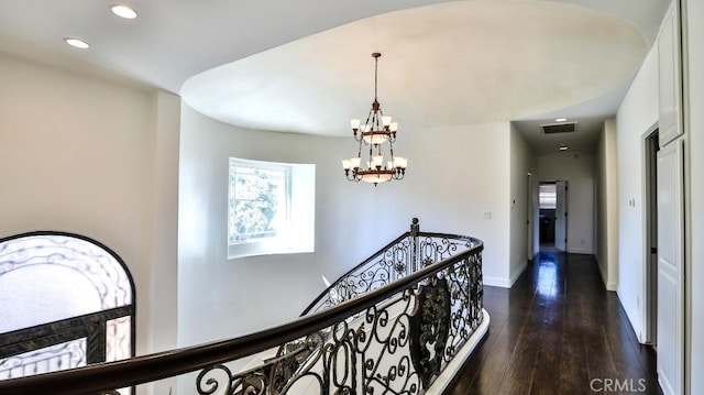 hall featuring visible vents, recessed lighting, a healthy amount of sunlight, and an inviting chandelier