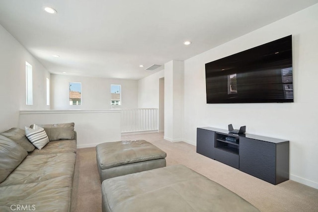 living area with light colored carpet, recessed lighting, baseboards, and visible vents