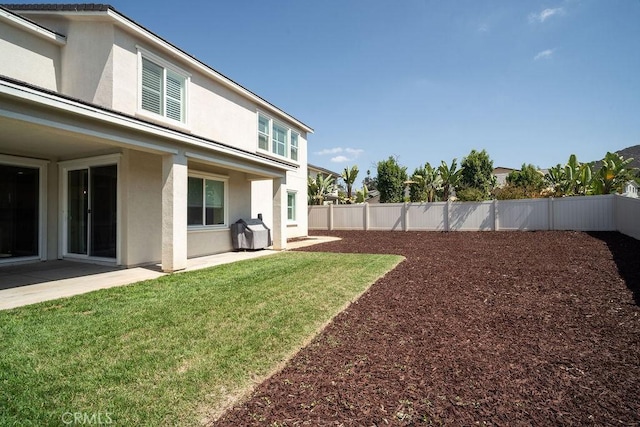 view of yard featuring a fenced backyard and a patio