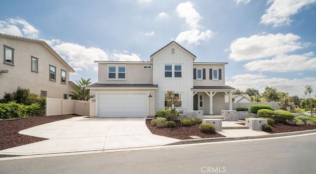 traditional-style house featuring stucco siding, a garage, fence, and driveway