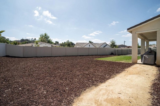 view of yard with a fenced backyard