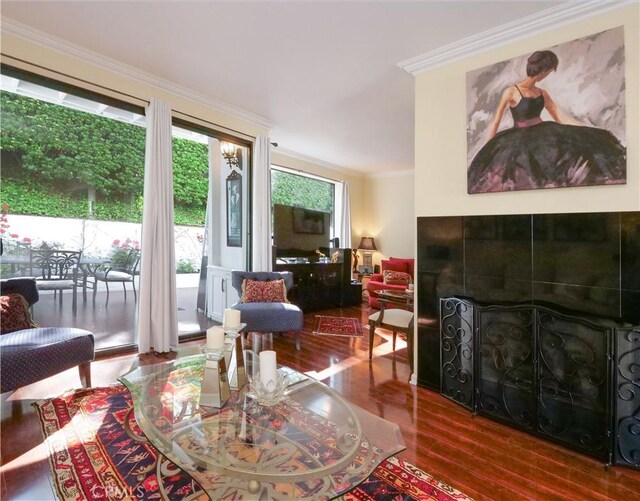1150 W Capitol Unit 32, San Pedro, CA 90732 - living area with ornamental molding, a fireplace, and wood finished floors