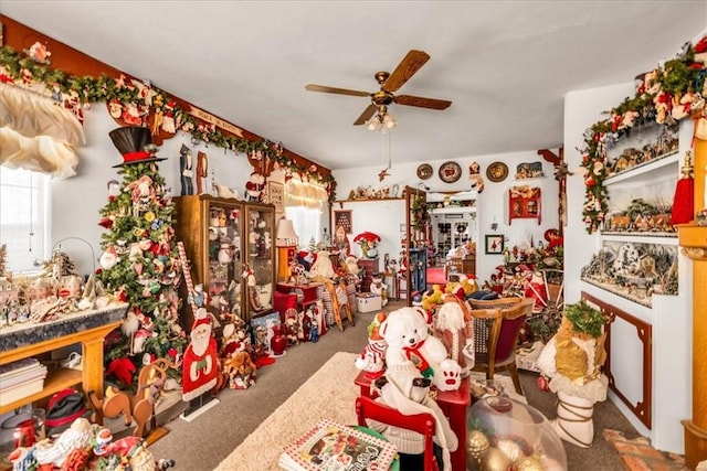 miscellaneous room with carpet floors and ceiling fan