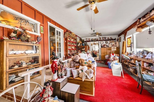 miscellaneous room with carpet flooring and a ceiling fan