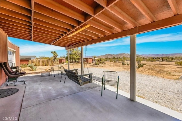 view of patio / terrace featuring a mountain view