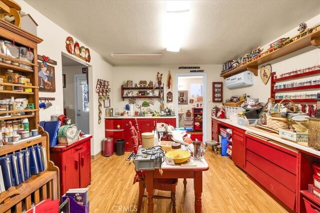 kitchen featuring red cabinetry, open shelves, and light wood-style floors
