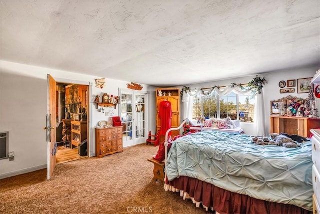 carpeted bedroom with a textured ceiling