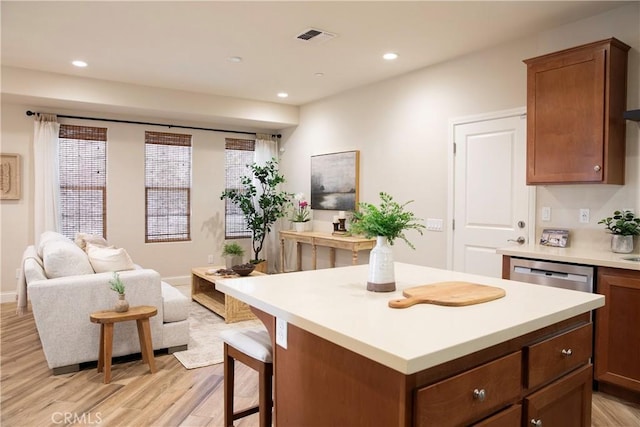 9369 Riberena Cir Unit 11, Atascadero, CA 93422 - kitchen with light wood-style floors, open floor plan, light countertops, a center island, and recessed lighting
