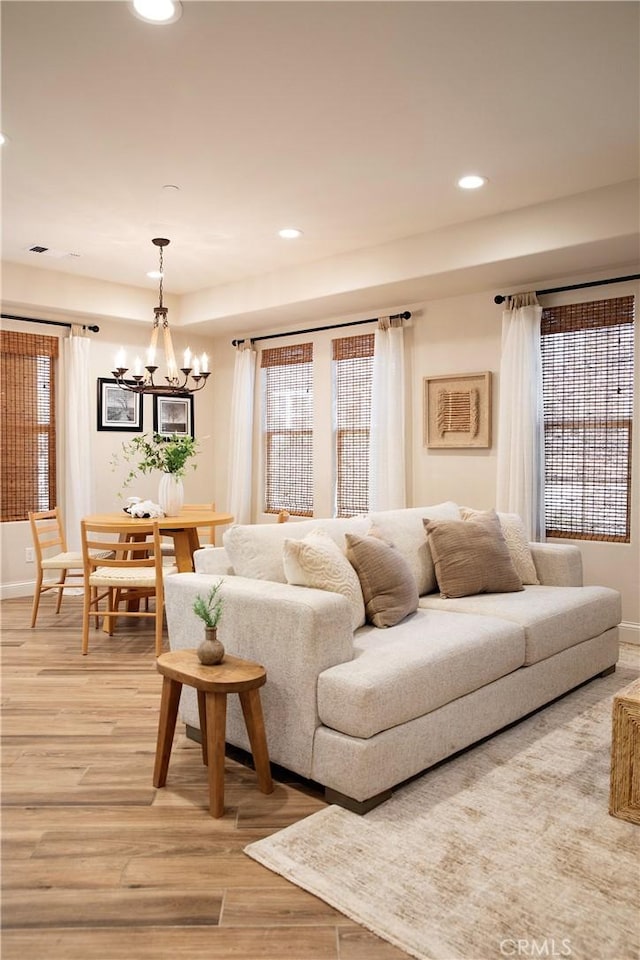 9369 Riberena Cir Unit 11, Atascadero, CA 93422 - living area featuring light wood finished floors, a chandelier, recessed lighting, and plenty of natural light