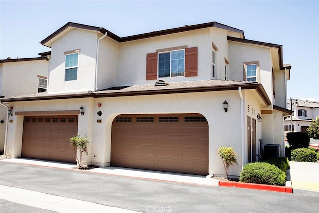 9369 Riberena Cir Unit 11, Atascadero, CA 93422 - view of front facade with an attached garage and stucco siding
