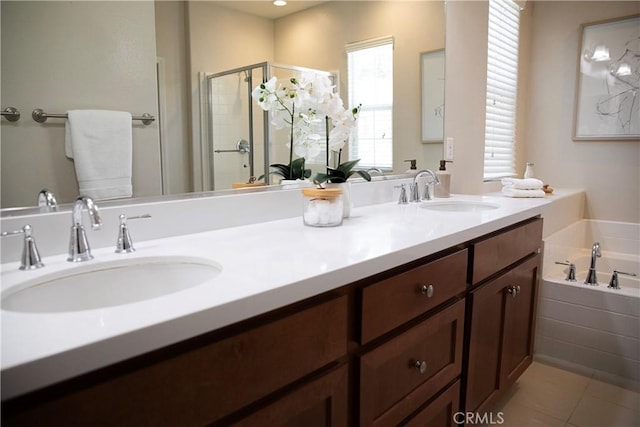 9369 Riberena Cir Unit 11, Atascadero, CA 93422 - full bathroom featuring a shower stall, double vanity, a garden tub, and tile patterned flooring