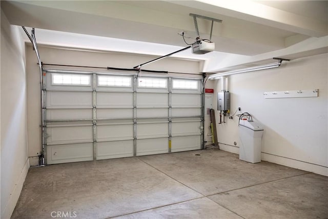 9369 Riberena Cir Unit 11, Atascadero, CA 93422 - garage with a garage door opener and tankless water heater