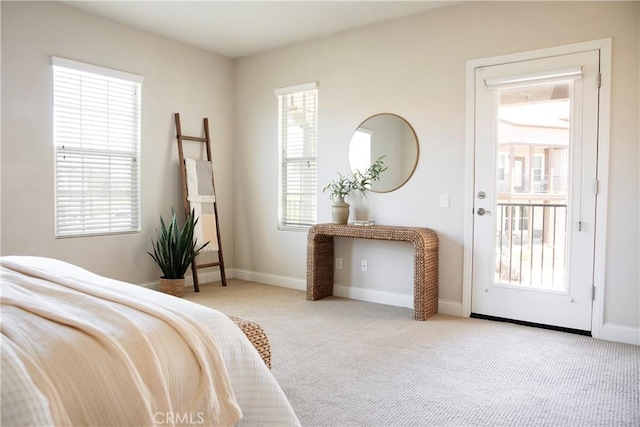 9369 Riberena Cir Unit 11, Atascadero, CA 93422 - carpeted bedroom featuring multiple windows and access to outside