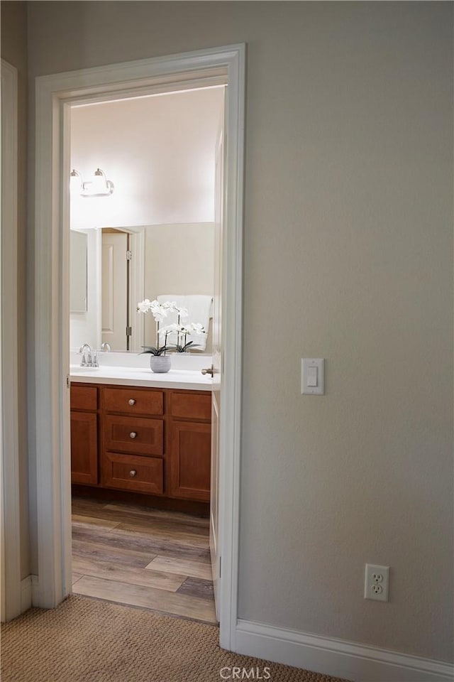 9369 Riberena Cir Unit 11, Atascadero, CA 93422 - bathroom with double vanity and wood finished floors