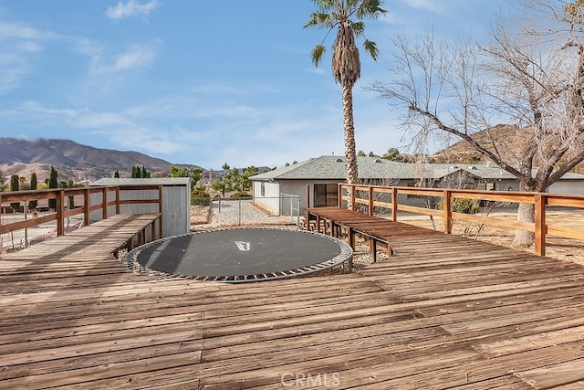 wooden deck with a mountain view