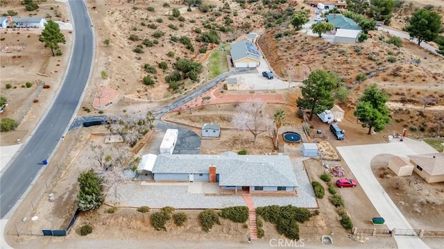 birds eye view of property with a desert view
