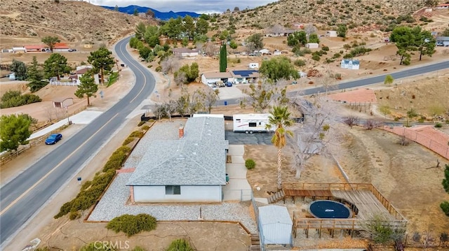 birds eye view of property with a mountain view