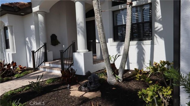 3615 Towhee Court, Punta Gorda, FL 33950 - view of exterior entry featuring stucco siding