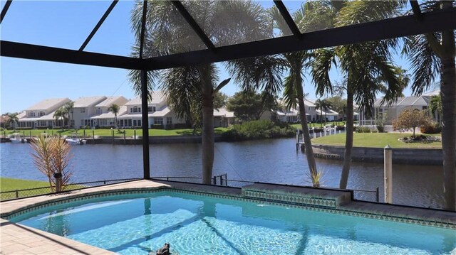 3615 Towhee Court, Punta Gorda, FL 33950 - pool with a water view, a residential view, and glass enclosure