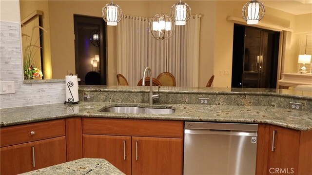 3615 Towhee Court, Punta Gorda, FL 33950 - kitchen with light stone counters, a sink, and dishwasher