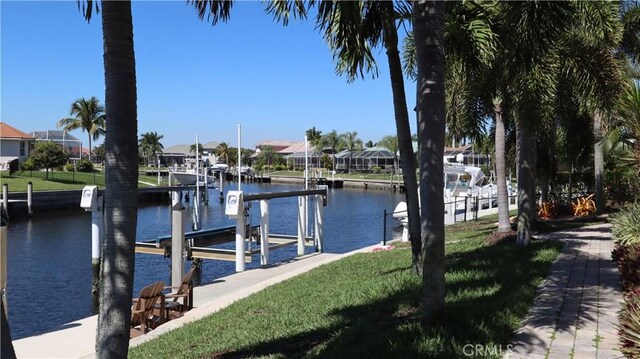 3615 Towhee Court, Punta Gorda, FL 33950 - view of dock with a water view, a residential view, and boat lift