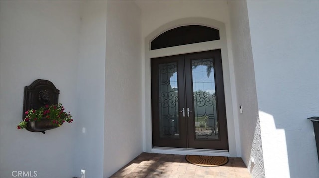 3615 Towhee Court, Punta Gorda, FL 33950 - property entrance with stucco siding and french doors