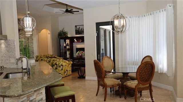 3615 Towhee Court, Punta Gorda, FL 33950 - dining space featuring light tile patterned floors, baseboards, and arched walkways