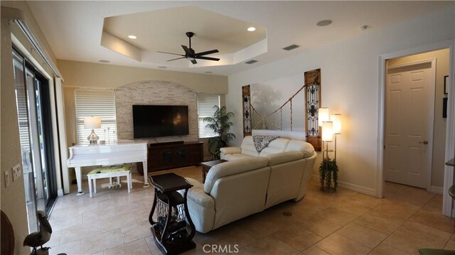3615 Towhee Court, Punta Gorda, FL 33950 - living room featuring light tile patterned floors, recessed lighting, a tray ceiling, and ceiling fan