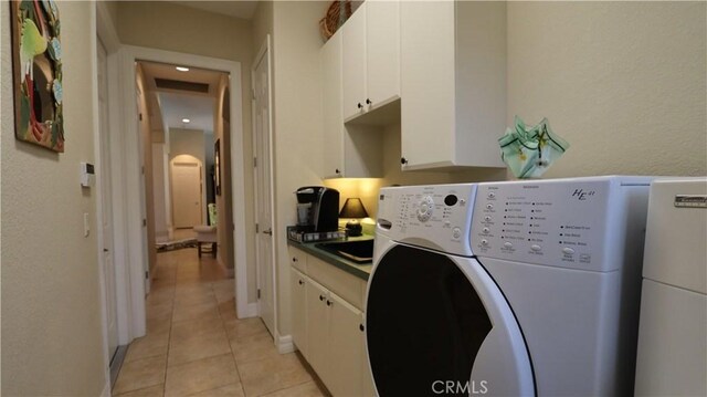 3615 Towhee Court, Punta Gorda, FL 33950 - laundry room featuring light tile patterned flooring, cabinet space, visible vents, and washer and dryer