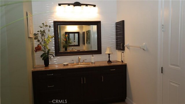 3615 Towhee Court, Punta Gorda, FL 33950 - bathroom with vanity and decorative backsplash