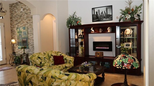 3615 Towhee Court, Punta Gorda, FL 33950 - sitting room with a warm lit fireplace and arched walkways
